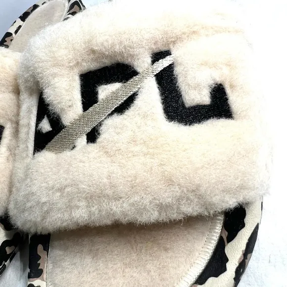 APL Athletic Propulsion Labs Cream and Black Fur Slides with Animal Print