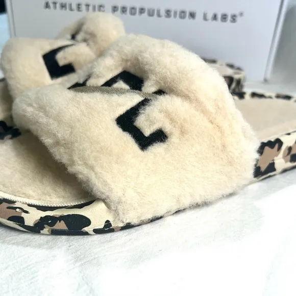 APL Athletic Propulsion Labs Cream and Black Fur Slides with Animal Print