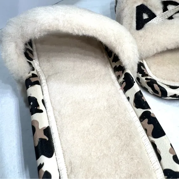 APL Athletic Propulsion Labs Cream and Black Fur Slides with Animal Print