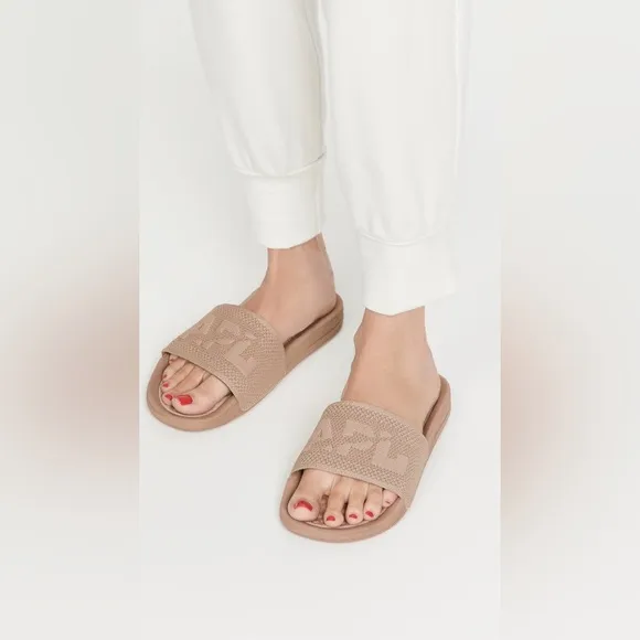 APL: Athletic Propulsion Labs Women’s Big Logo Techloom Slides in Parchment