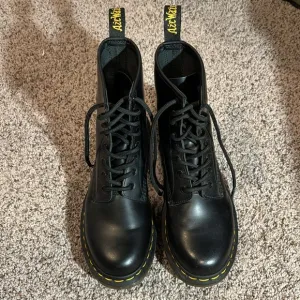 Black leather high top DRMARTENS boots