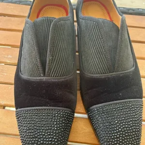 Christian Louboutin Black Loafers with Textured Toe Cap barely won