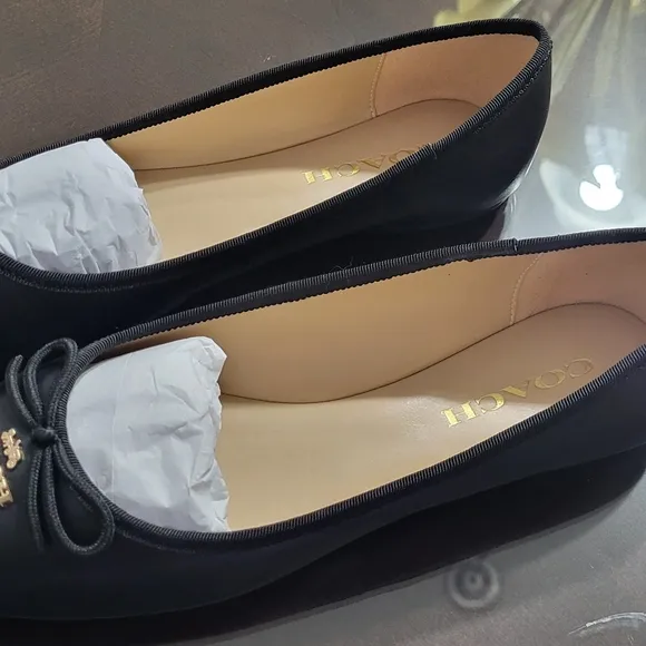 Coach Black Flats with Elegant Bow and Logo.