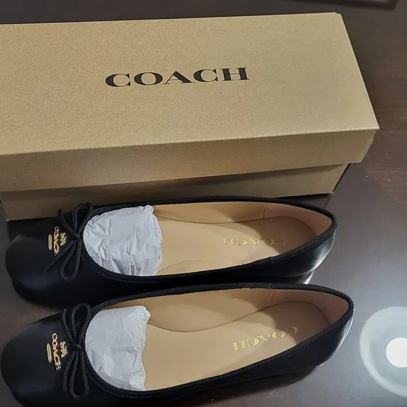 Coach Black Flats with Elegant Bow and Logo.