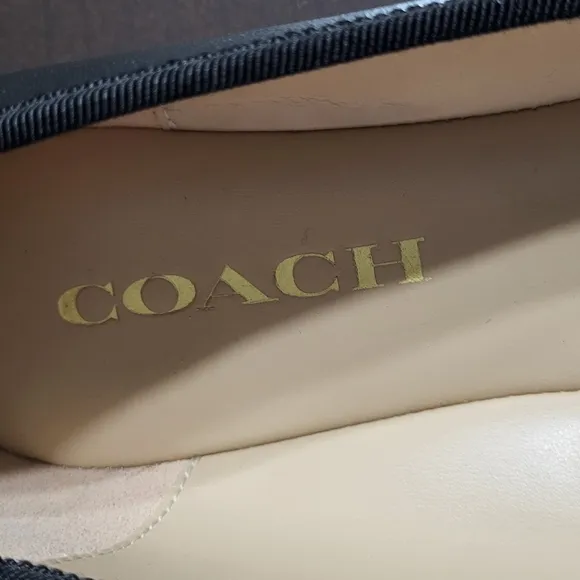 Coach Black Flats with Elegant Bow and Logo.