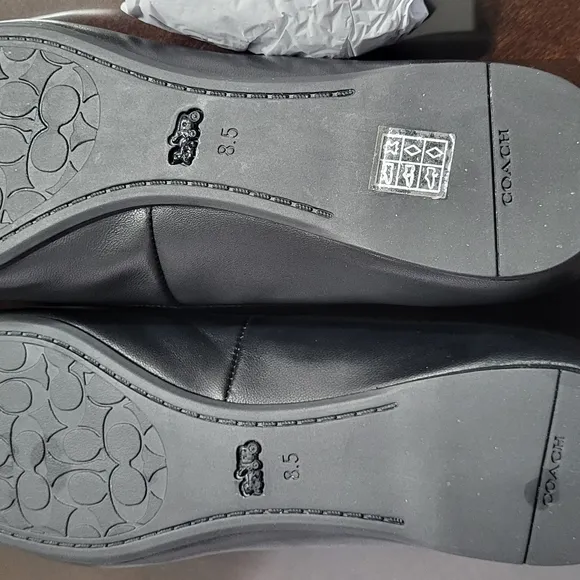 Coach Black Flats with Elegant Bow and Logo.