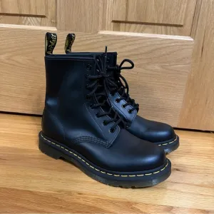 Doc Martens 1460 Womens Black Lace-Up Boots with yellow welt stitching