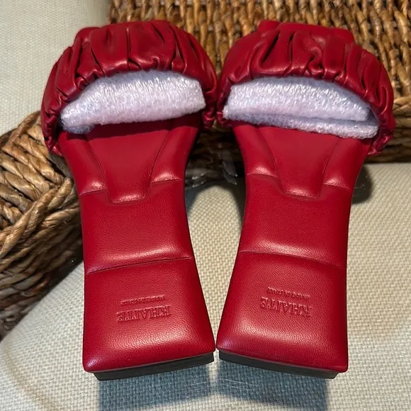 KHAITE Red Leather Slide sandals.