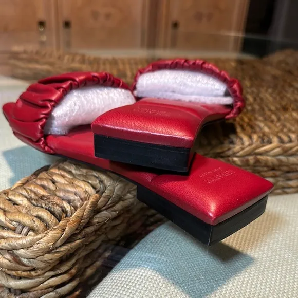 KHAITE Red Leather Slide sandals.