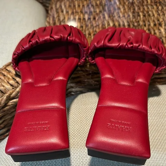 KHAITE Red Leather Slide sandals.