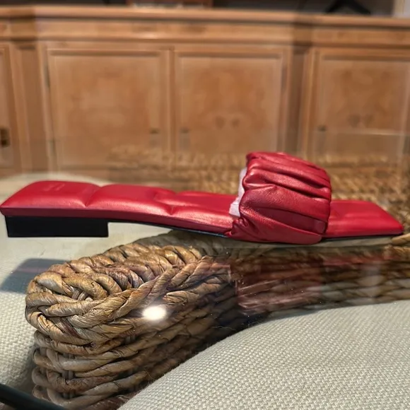 KHAITE Red Leather Slide sandals.