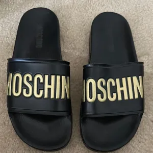 Moschino Black and Gold Slides
