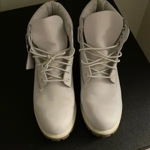 Stylish White Lace-Up Boots